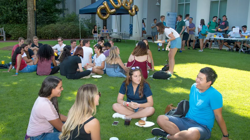 Students socialize on the green